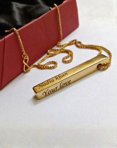 3D Gold-plated Bar Necklace with "Nadia khan" and "Your love" engraved, displayed with a red jewelry box.