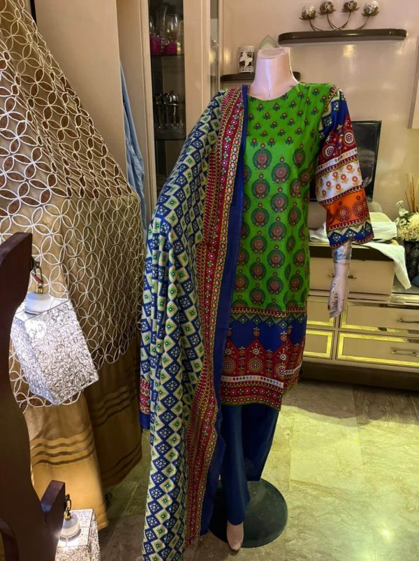 A 3-Piece stitched, peacock colored article Morni from our Festive Eid Collection 2022.