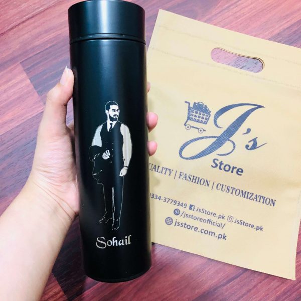 A stylish black customized temperature bottle with engraved picture of the receiver.