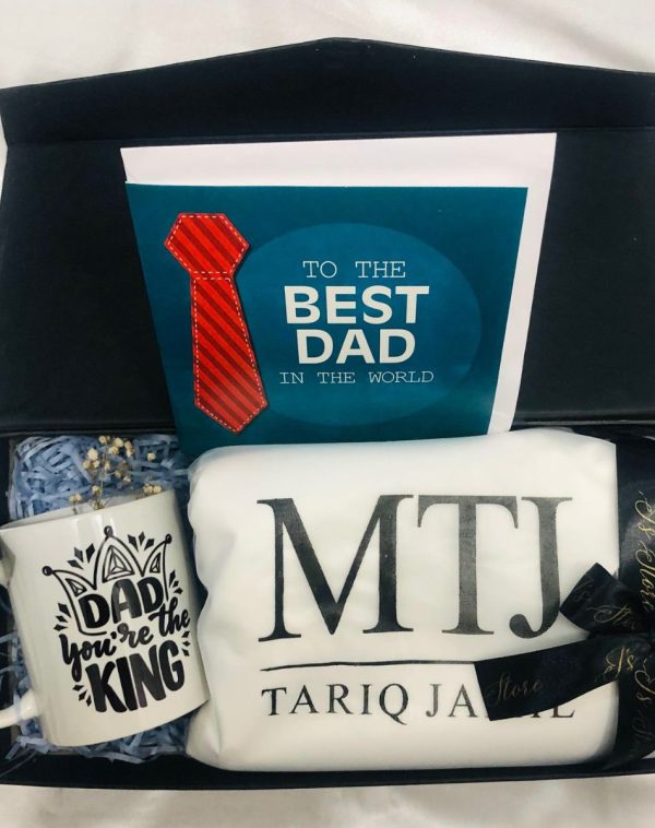 Father's Day Celebration Gift Box featuring MTJ Shalwar Suit Fabric, "Dad You Are The King" Mug, and Personalized Card, presented in a straight arrangement.
