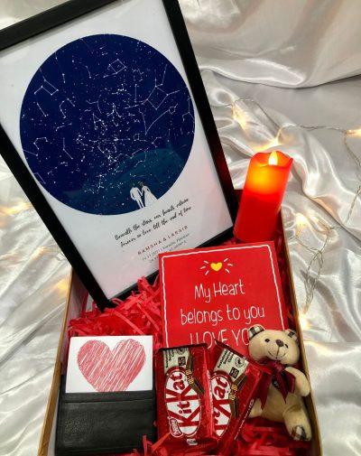 The Love in The Sky Gift Box is a unique and personalized anniversary gift that features a celestial map of the night sky with the couple's names and a special date or event. The main item, the Star Map Frame, is a beautiful and sentimental keepsake that can identify and locate constellations, stars, nebulae, galaxies, and planets on a specific date and time. The gift box also includes a red LED candle, a stylish leather cash and cardholder, chocolates, a greeting card, and premium gift box packaging. This gift box is a perfect way to show your love in the stars and make your anniversary a special and memorable one.