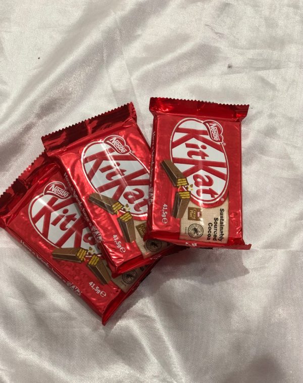 "Sweet Indulgences - 3 KitKats & 4 Bars on White Silk Background.