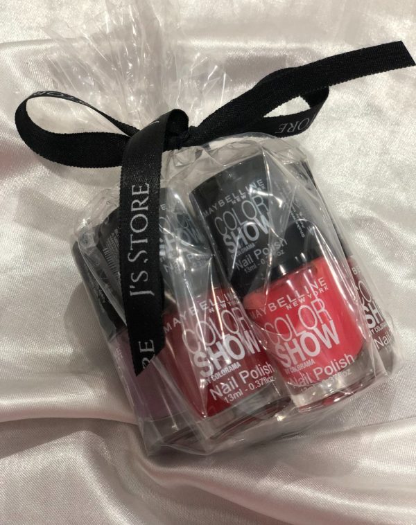 Glamorous Maybelline Nail Paints Set on White Silk Background.