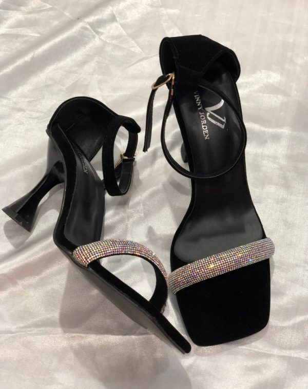 Elegant Vinny Jorden Heel in Black on White Silk Background.