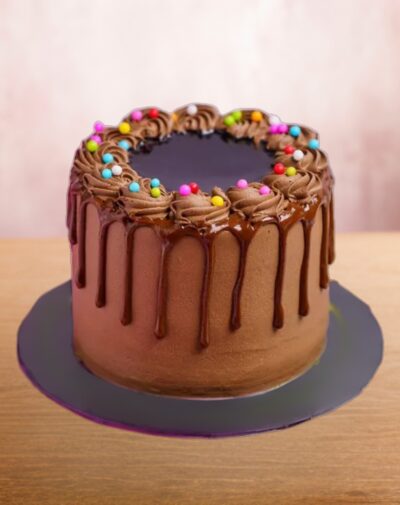 Ultimate Chocolate Sprinkle - Delicious Belgian chocolate cake with rich frosting, chocolate drips, and colorful candy sprinkles.