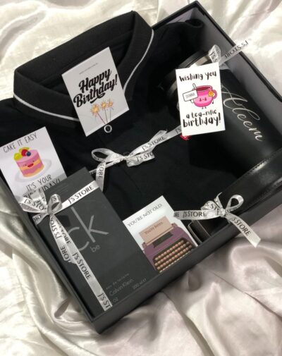 The Modern Man's Box premium gift set for him in Pakistan with CK Be perfume, polo shirt, custom tumbler, and leather belt.