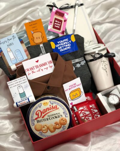 The Allure Box by J’s Store – Premium gift box for him with watch, coffee tumbler, cookies, notebook, apparel, hoodie, lip balm, and KitKat.