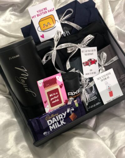 The Dapper Box gift set for him featuring black quencher tumbler, Zara shirts, Solace perfume, and Axe body wash.