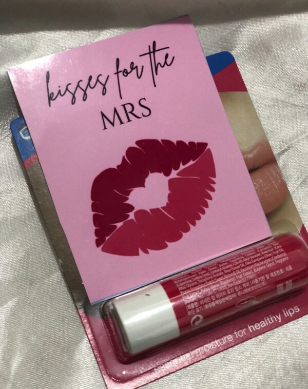 A tube of Vaseline brand lip balm in a "Red Cherry" flavor.