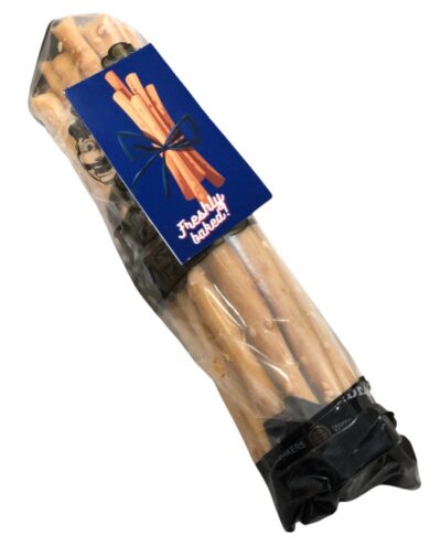 A clear plastic bag containing a bundle of Crispy Breadsticks with a blue tag that reads "Freshly baked!