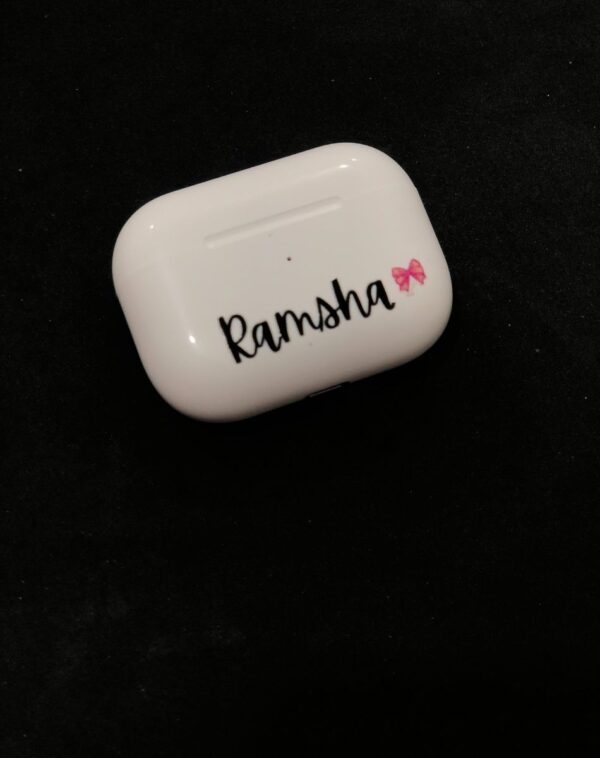 Customized Name AirPods Pro with wireless charging case, featuring the name "Ramsha" and a pink bow graphic.