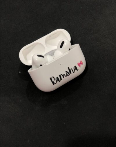 Customized Name AirPods Pro Case with wireless charging, white color, featuring the name "Ramsha" and a pink bow graphic.