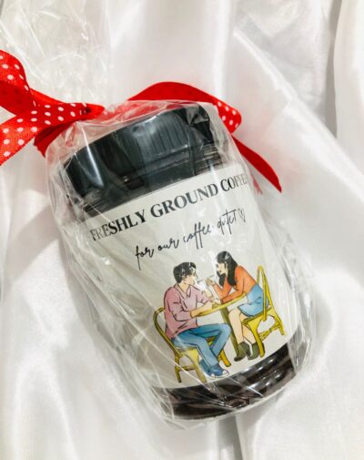 Freshly Ground Coffee Jar from J’s Store with a romantic coffee date illustration, tied with a red ribbon.