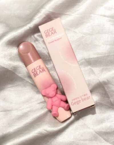 GEGE BEAR Tender Lip Gloss in a pink tube with a cute 3D bear detail, next to its matching box.