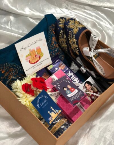 Luxe Traditions Box from J’s Store is a premium Eid Gift Boxes For Her set featuring a stitched suit and khussa.
