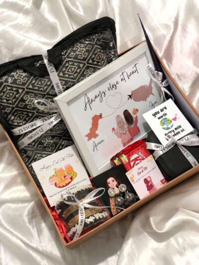 Miles Apart, Hearts Together Box is a premium Eid Gift Boxes For Her set from J’s Store featuring an Unstitched Suit and Jewelry.
