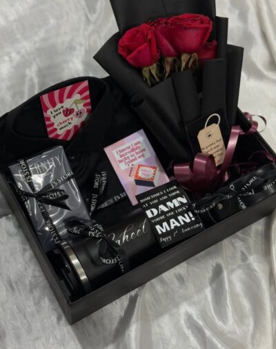 The Eternity Premier gift box from J’s Store featuring CK Eternity For Men perfume, The Eternity Petals Bouquet, Customized Coffee Tumbler, Leather belt and a black shirt.