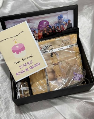 The "Everything She Is" Box featuring a 3-piece suit, custom mug, and frame from J’s Store.